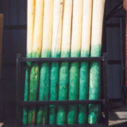 Bundled fence posts treated with copper naphthenate
